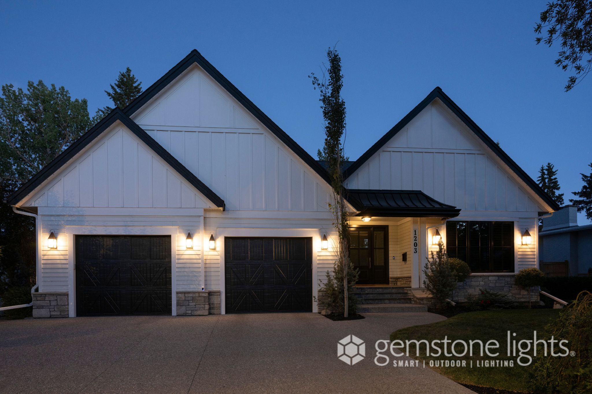 Farmhouse exterior before permanent lighting is previewed